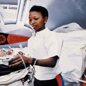 Mae Jemison aboard Space Shuttle Endeavour during STS-47 preparing to deploy the lower body negative pressure (LBNP) apparatus. Photo Credit: Wikipedia